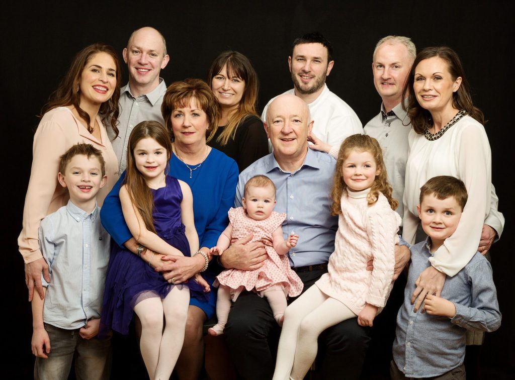 Christmas gift for parents & grandparents: a generational family portrait of grandparents, parents & grandchildren taken in a professional family portrait photography studio 
